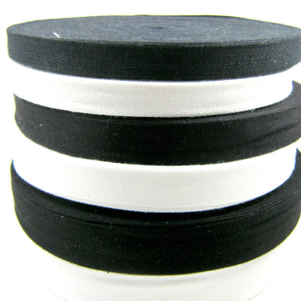 A collection of black and white cotton India tape on a white background