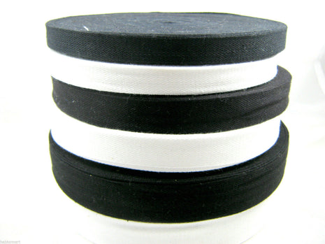 A collection of black and white cotton India tape on a white background