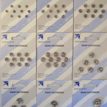 Packaging of nickel plated brass snap fasteners, displaying various fasteners on a card.