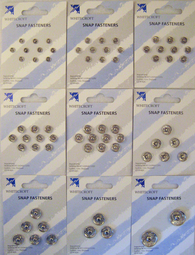 Packaging of nickel plated brass snap fasteners, displaying various fasteners on a card.