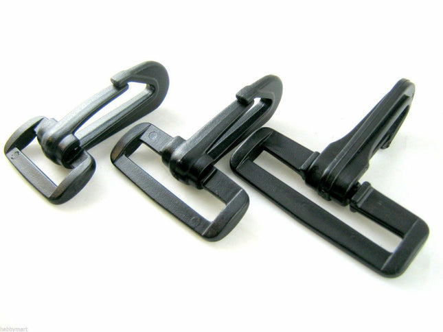 Three black plastic snap hooks of different sizes arranged in a row on a white background.