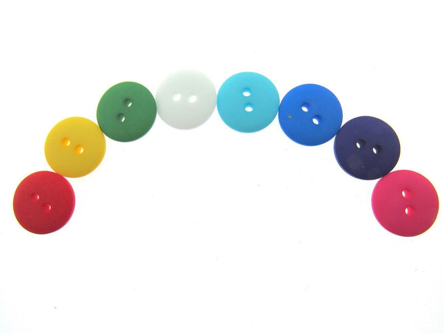 An assortment of round, double domed buttons in various colors displayed in a row.