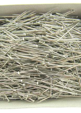 A box filled with nickel plated pins, approximately 1000 pins, displayed in araft box.