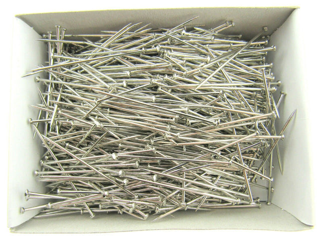 A box filled with nickel plated pins, approximately 1000 pins, displayed in araft box.