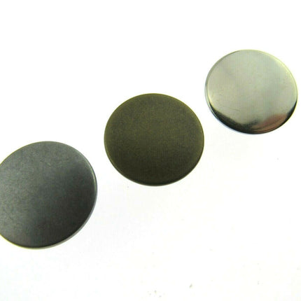17mm no sew hammer home jean buttons in silver, gunmetal or antique brass sitting side by side in a diagonal row
