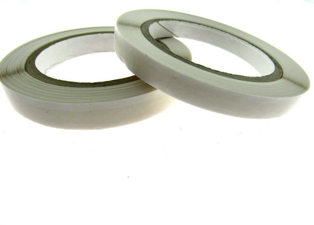 Easy lift double sided sticky tape 33m reels with extended paper backing for easy peeling, Acid free scrapbooking and card making tape rolls close up showing adhesive widths, Professional finger tear double sided craft tape available in 6mm and 8mm widths