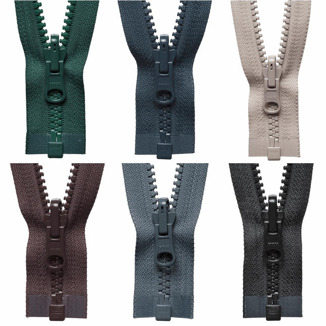 A collection of YKK reversible flip-over plastic open-end zippers in various colors including green, beige, brown, blue, gray, and black.