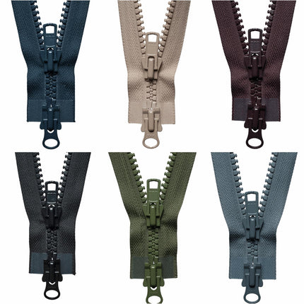 A collection of YKK heavy-duty two-way open end plastic zippers in various colors.