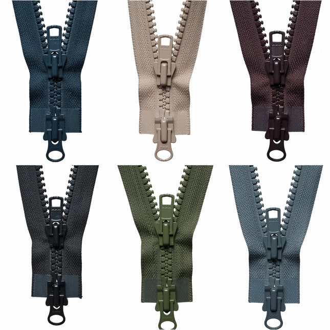 A collection of YKK heavy-duty two-way open end plastic zippers in various colors.
