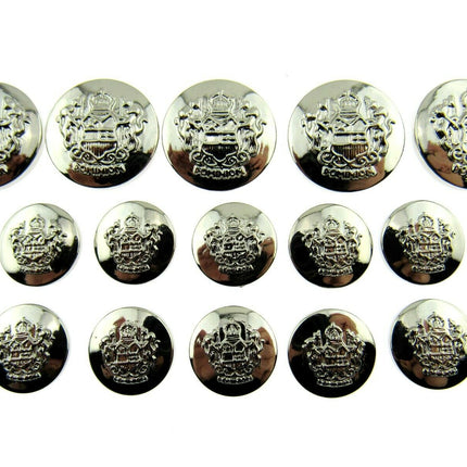 A collection of round silver plastic crested blazer buttons, varying in size and with a reflective silver finish.