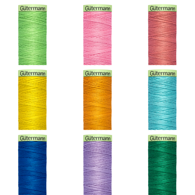 A collection of Gutermann Top Stitch 100% Polyester sewing thread reels in assorted colors.