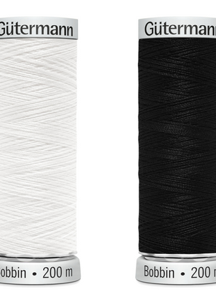 Two reels of Gutterman Sulky bobbin embroidery thread in black and white, each with 200 meters of thread.