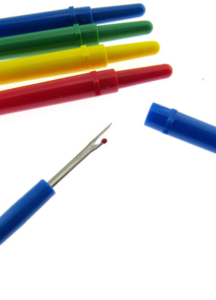 A selection of stitch rippers on a white background
