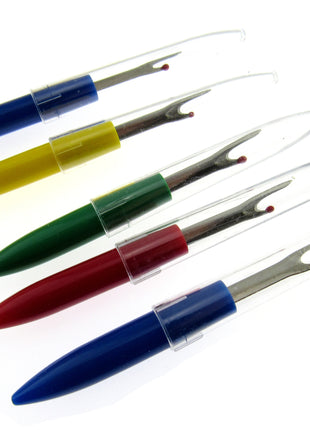 A selection of seam rippers on a white background