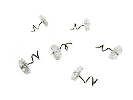 Prym clear head twist pins 13mm long for upholstery close up view, Spiral upholstery screw pins with 10mm clear head holding an arm cap on a sofa, Pack sizes selection of clear twist furniture fasteners for loose covers
