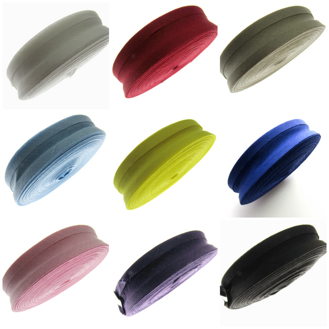 A collection of bias binding tapes in various colors, displayed horizontally.