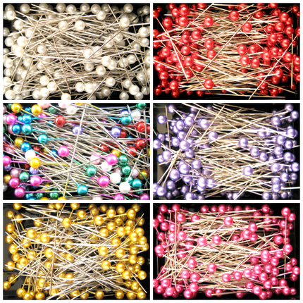 Boxes containing 40mm long pearl craft pins in various colors including white, red, blue, purple, yellow, and pink.