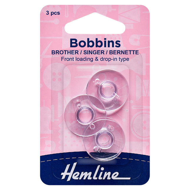 Package of three plastic bobbins compatible with Brother, Singer, and Bernette sewing machines, displayed in clear packaging with pink and blue branding.