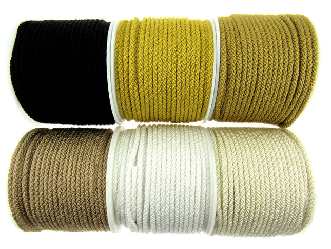Assorted colors of rayon braided lacing drawstring cord, displayed in rolls.