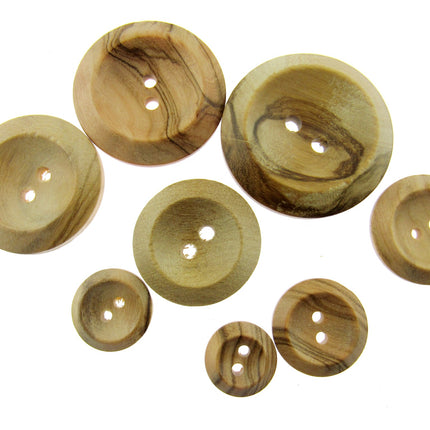 A collection of round wooden buttons with two holes and a wedge rim, varying in size, displayed on a white background.