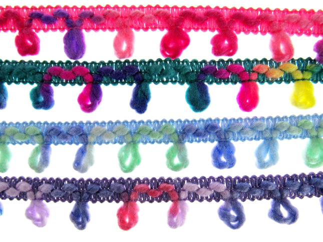 A series of woolen unicorn braided trims in various colors, arranged side by side.