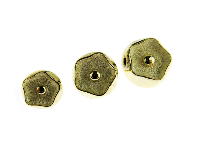 Gold Poppy head style shank buttons on a white background