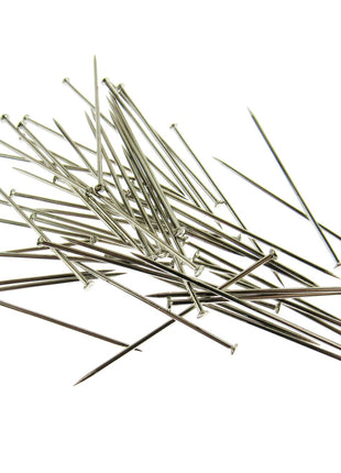 A selection of long straight steel pins on a white background