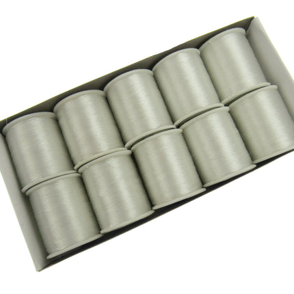 A pack of invisible thread reels, with each reel appearing cylindrical and clear in colour.