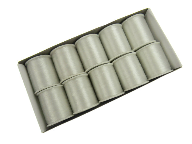 A pack of invisible thread reels, with each reel appearing cylindrical and clear in colour.
