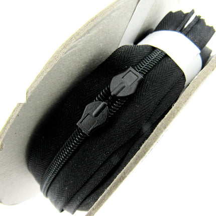 Six meters of continuous invisible zip chain on a roll with 12 sliders available in black, ivory, white and cream