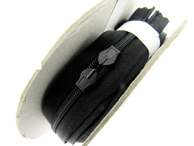 Six meters of continuous invisible zip chain on a roll with 12 sliders available in black, ivory, white and cream