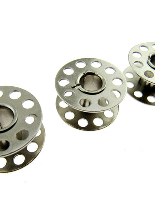 Three 15k bobbins on a white background