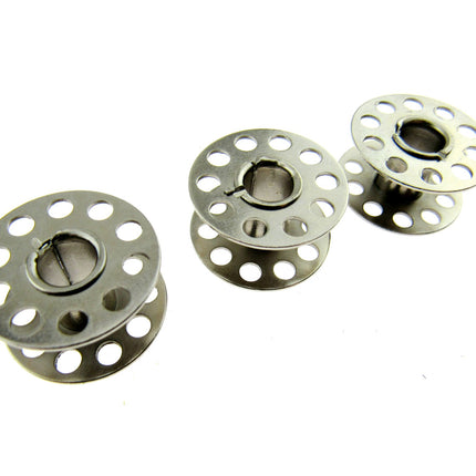 Three 15k bobbins on a white background