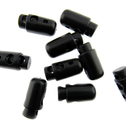 A collection of black torpedo cord locks approximately 25mm x 13mm in size, displayed on a white background.
