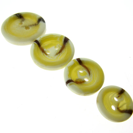 Aran wool buttons with brown fleck in 4 sizes arranged in a neat row on a white background