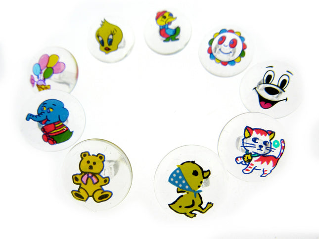 Children's clear crystal animal chank buttons on a white background
