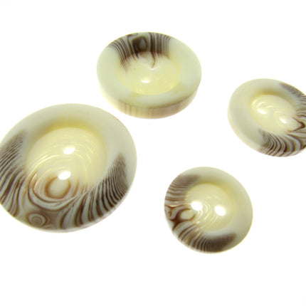 A set of four round 2-hole sew-through buttons with a brown fleck design.