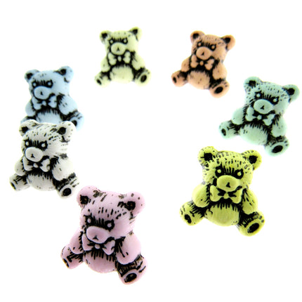 Etched teddy bear buttons in pastel colours on a white background