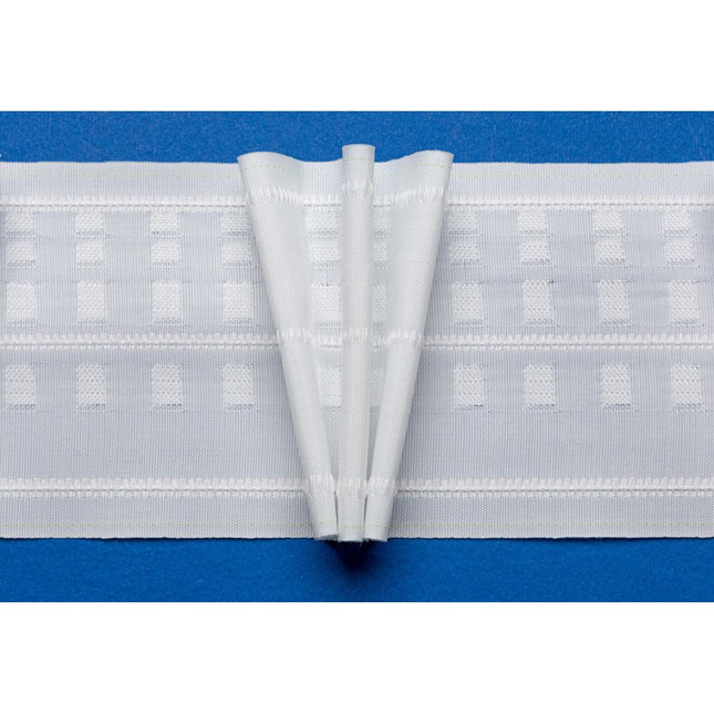 A length of white pinch pleat curtain tape with three pleats, displayed against a blue background.