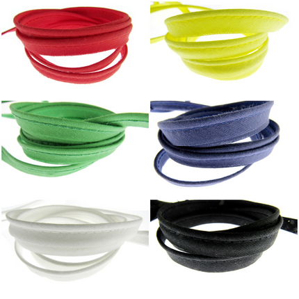 A collection of bias cotton piping cord insertion trim with flange in various colors including red, yellow, green, blue, white, and black.