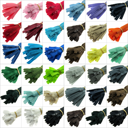 An array of zips in multiple colours on a white background