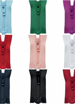 An assortment of YKK lightweight open end nylon zippers displayed in multiple colors.