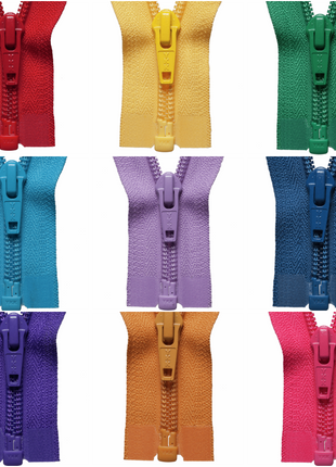 An array of YKK nylon open end zippers in various colours, including red, yellow, green, blue, purple, orange, and pink.