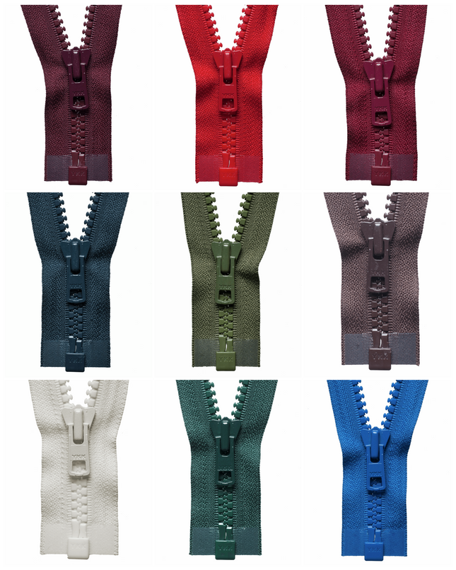A collection of YKK Vislon heavy duty plastic open end zips in various colors.